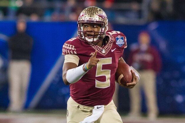 Dec 6, 2014; Charlotte, NC, USA; Florida State Seminoles quarterback Jameis Winston (5) runs the ball during the second quarter against the Georgia Tech Yellow Jackets at Bank of America Stadium. Mandatory Credit: Jeremy Brevard-USA TODAY Sports