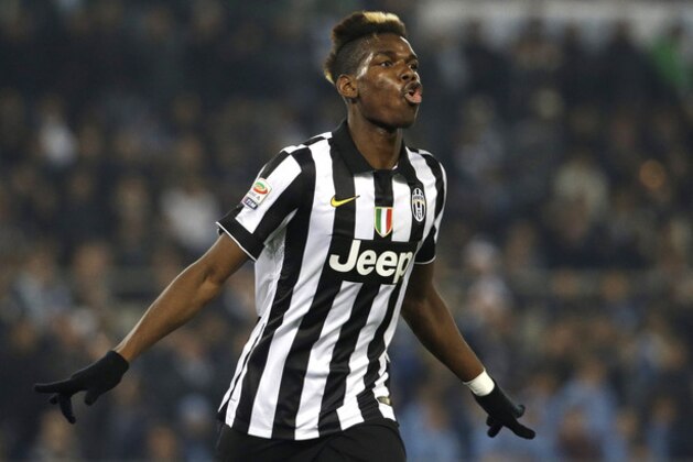Juventus' Paul Pogba celebrates after scoring during the Serie A soccer match between Lazio and Juventus at Rome's Olympic Stadium, Saturday, Nov. 22, 2014. (AP Photo/Gregorio Borgia)