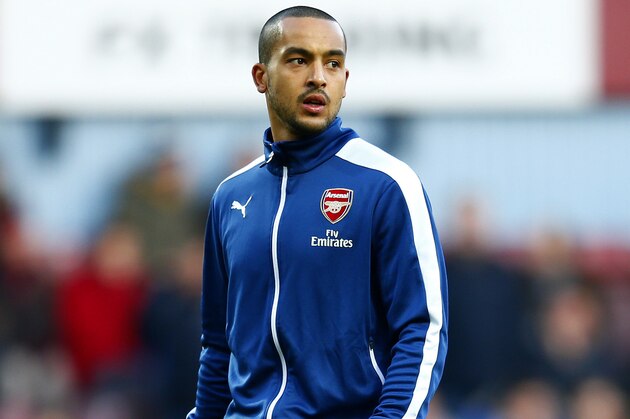 LONDON, ENGLAND - DECEMBER 28:  Theo Walcott of Arsenal takes part in the warm-up before the Barclays Premier League match between West Ham United and Arsenal at Boleyn Ground on December 28, 2014 in London, England.  (Photo by Julian Finney/Getty Images)