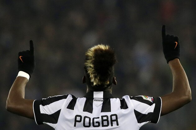 Juventus' Paul Pogba, celebrates after scoring during the Serie A soccer match between Lazio and Juventus at Rome's Olympic Stadium, Saturday, Nov. 22, 2014. (AP Photo/Gregorio Borgia)