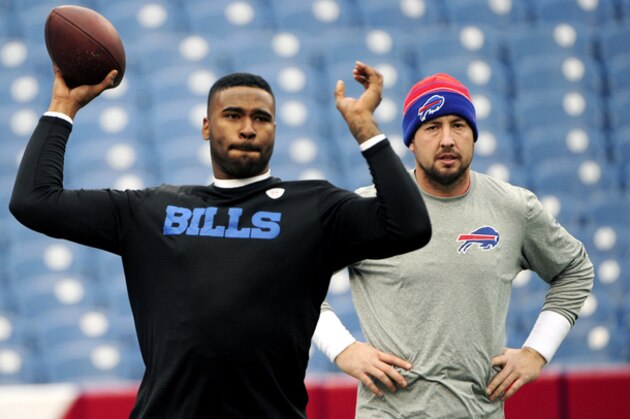 Buffalo Bills quarterback Kyle Orton, right, looks as quarterback EJ Manuel throws prior to an NFL football game against the Cleveland Browns, Sunday, Nov. 30, 2014, in Orchard Park, N.J. (AP Photo/Gary Wiepert)