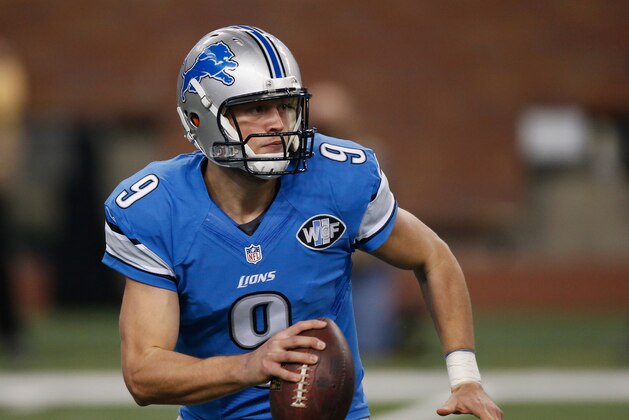 DETROIT, MI - DECEMBER 07: Matthew Stafford #9 of the Detroit Lions looks to throw a first quarter pass against the  Tampa Bay Buccaneers at Ford Field on December 07, 2014 in Detroit, Michigan. (Photo by Gregory Shamus/Getty Images)