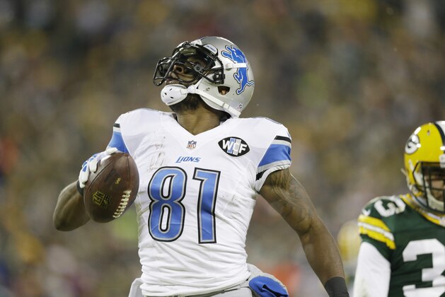 Detroit Lions' Calvin Johnson catches a touchdown pass during the first half of an NFL football game against the Green Bay Packers Sunday, Dec. 28, 2014, in Green Bay, Wis. (AP Photo/Tom Lynn)