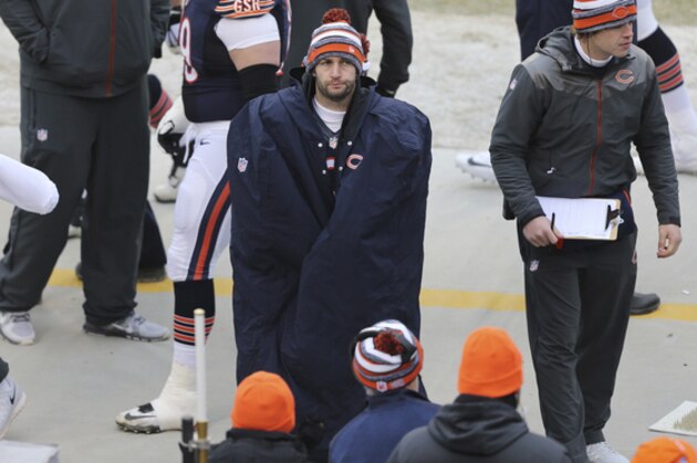Chicago Bears quarterback Jay Cutler stands on the sidelines in the first half of an NFL football game against the Detroit Lions Sunday, Dec. 21, 2014, in Chicago. (AP Photo/Charles Rex Arbogast)