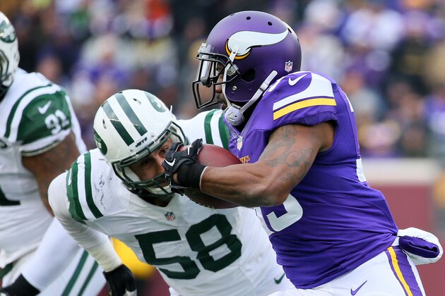 MINNEAPOLIS, MN - DECEMBER 7: Ben Tate #33 of the Minnesota Vikings carries the ball while Jason Babin #58 of the New York Jets eyes the play in the fourth quarter on December 7, 2014 at TCF Bank Stadium in Minneapolis, Minnesota. (Photo by Adam Bettcher/Getty Images)