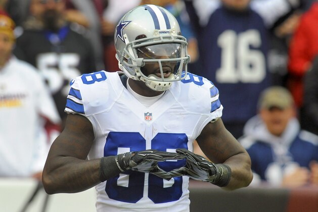 Dallas Cowboys wide receiver Dez Bryant (88) reacts after his touchdown during the first half of an NFL football game against the Washington Redskins in Landover, Md., Sunday, Dec. 28, 2014. (AP Photo/Richard Lipski)