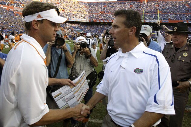 FILE - In this Sept. 19, 2009, file photo, Tennessee head coach Lane Kiffen, left, and Florida head coach Urban Meyer shake hands after No. 1 Florida won 23-13 in an NCAA college football game in Gainesville, Fla. Kiffin is something of an expert in facing the nation's No. 1 team. Tennessee has already played then-No. 1 Florida and next up is Alabama on Saturday. (AP Photo/John Raoux, File)