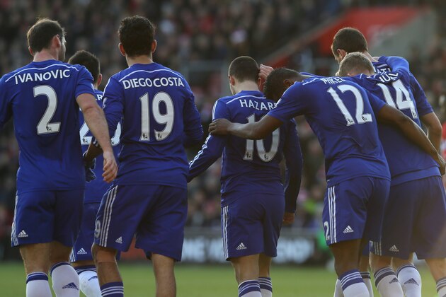 Chelsea’s Eden Hazard, centre, is congratulated by his teammates after scoring a goal during the English Premier League soccer match between Southampton and Chelsea at St Mary's Stadium, Southampton, England, Sunday, Dec. 28, 2014. (AP Photo/Tim Ireland)