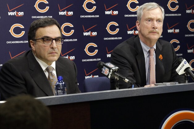 Chicago Bears President and CEO Ted Phillips, left, and Chairman George H. McCaskey listen to question at a news conference at Halas Hall on Monday, Dec. 29, 2014,  in Lake Forest, Ill. Chicago Bears head coach Marc Trestman and general manager Phil Emery were fired Monday. (AP Photo/Nam Y. Huh)