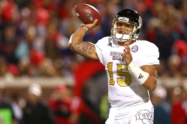 OXFORD, MS - NOVEMBER 29:  Dak Prescott #15 of the Mississippi State Bulldogs drops back to pass during their game against the Mississippi Rebels at Vaught-Hemingway Stadium on November 29, 2014 in Oxford, Mississippi.  (Photo by Streeter Lecka/Getty Images)