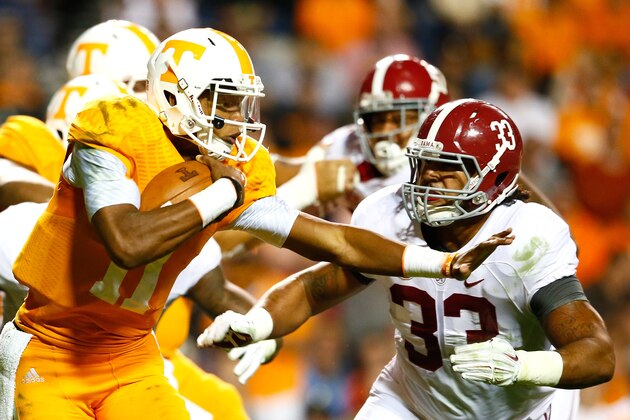 KNOXVILLE, TN - OCTOBER 25:  Joshua Dobbs #11 of the Tennessee Volunteers against Trey DePriest #33 of the Alabama Crimson Tide at Neyland Stadium on October 25, 2014 in Knoxville, Tennessee.  (Photo by Kevin C. Cox/Getty Images)