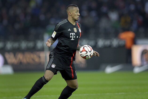 Bayern's Jerome Boateng plays the ball during the German Bundesliga soccer match between Hertha BSC and FC Bayern Munich at the Olympia stadium in Berlin, Germany, Saturday, Nov. 29, 2014. Munich defeated Berlin by1-0. (AP Photo/Michael Sohn)