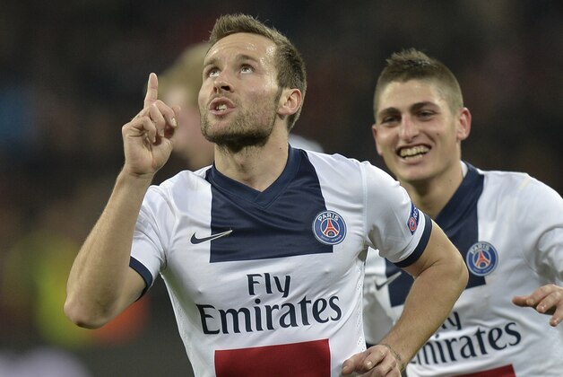 PSG's Yohan Cabaye, left, celebrate his side's fourth goal during a Champions League round of the last 16 first leg soccer match between Bayer Leverkusen and Paris Saint-Germain in Leverkusen, Germany, Tuesday Feb. 18, 2014.  (AP Photo/Martin Meissner)