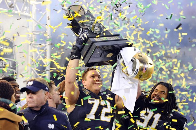 Dec 30, 2014; Nashville, TN, USA; Notre Dame Fighting Irish offensive lineman Nick Martin (72) and defensive lineman Sheldon Day (91) celebrate after winning the game against the LSU Tigers in the Music City Bowl at LP Field. Notre Dame won 31-28. Mandatory Credit: Christopher Hanewinckel-USA TODAY Sports