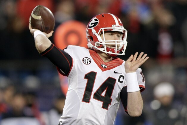 Georgia quarterback Hutson Mason looks to pass against Louisville during the first half of the Belk Bowl NCAA college football game in Charlotte, N.C., Tuesday, Dec. 30, 2014. (AP Photo/Chuck Burton)