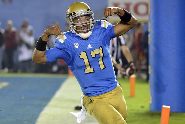 Nov 22, 2014; Pasadena, CA, USA; UCLA Bruins quarterback Brett Hundley (17) celebrates after scoring a touchdown against the Southern California Trojans during the second half at the Rose Bowl. Mandatory Credit: Richard Mackson-USA TODAY Sports