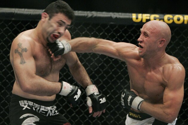 Josh Burkman, right, connects with a punch to Karo Parisyan during the second round of their welterweight bout, Saturday, May 26, 2007, at the MGM Grand Arena in Las Vegas. (AP Photo/Eric Jamison)