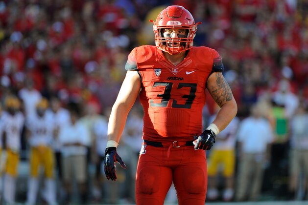 Nov 28, 2014; Tucson, AZ, USA; Arizona Wildcats linebacker Scooby Wright III (33) looks to the sideline during the third quarter of the territorial cup against the Arizona State Sun Devils at Arizona Stadium. The Wildcats won 42-35. Mandatory Credit: Casey Sapio-USA TODAY Sports