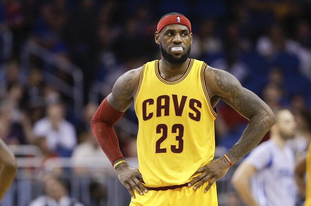 Cleveland Cavaliers' LeBron James on the court during the second half of an NBA basketball game against the Orlando Magic, Friday, Dec. 26, 2014, in Orlando, Fla.  Cleveland won 98-89. (AP Photo/John Raoux)