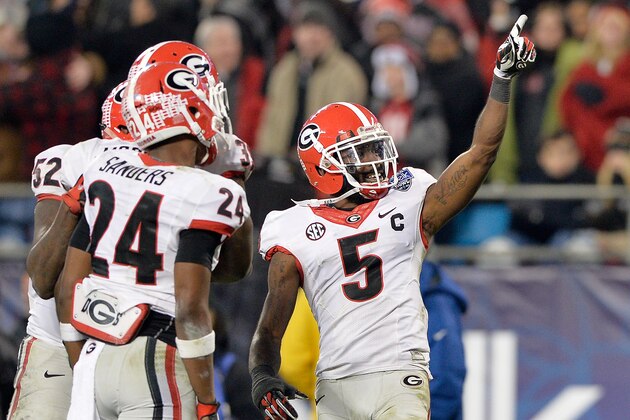 CHARLOTTE, NC - DECEMBER 30:  Damian Swann #5 of the Georgia Bulldogs salutes the fans after making an inteception against the Louisville Cardinals during the Belk Bowl at Bank of America Stadium on December 30, 2014 in Charlotte, North Carolina. Georgia won 37-14.  (Photo by Grant Halverson/Getty Images)