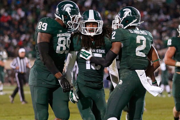 EAST LANSING, MI - OCTOBER 04: Trae Waynes #15 of the Michigan State Spartans celebrates a fourth quarter interception to seal a 27-22 win over the Nebraska Cornhuskers with teammates Shilique Calhoun #89 and Darian Hicks #2 at Spartan Stadium on October 4, 2014 in East Lansing, Michigan. (Photo by Gregory Shamus/Getty Images)