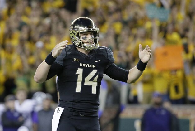 Baylor quarterback Bryce Petty (14) signals touchdown after running back Johnny Jefferson (2) scored on a running play in the first half of an NCAA college football game against Kansas State, Saturday, Dec. 6, 2014, in Waco, Texas. (AP Photo/Tony Gutierrez)