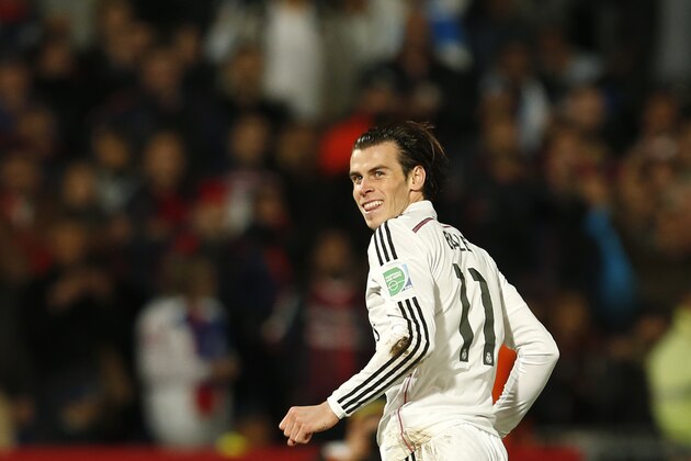 Real Madrid’s Gareth Bale runs after scoring during the final match against San Lorenzo  for the Club World Cup soccer tournament, in Marrakech, Morocco, Saturday, Dec. 20, 2014. (AP Photo/Abdeljalil Bounhar)