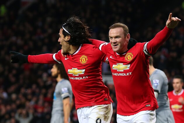 MANCHESTER, ENGLAND - DECEMBER 26:  Wayne Rooney of Manchester United celebrates scoring the first goal with team-mate Radamel Falcao (L) during the Barclays Premier League match between Manchester United and Newcastle United at Old Trafford on December 26, 2014 in Manchester, England.  (Photo by Alex Livesey/Getty Images)