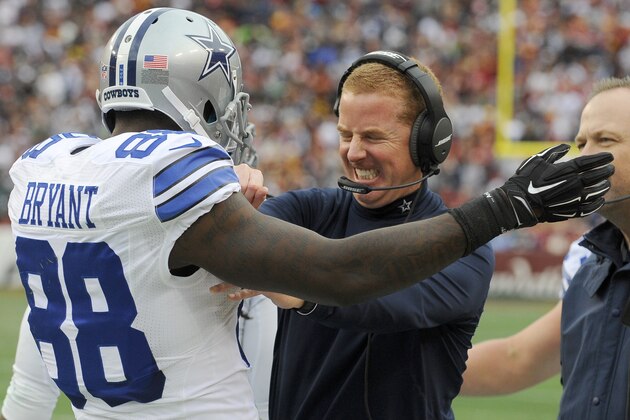 Dallas Cowboys wide receiver Dez Bryant (88) celebrates his touchdown with head coach Jason Garrett during the first half of an NFL football game against the Washington Redskins in Landover, Md., Sunday, Dec. 28, 2014. (AP Photo/Richard Lipski)