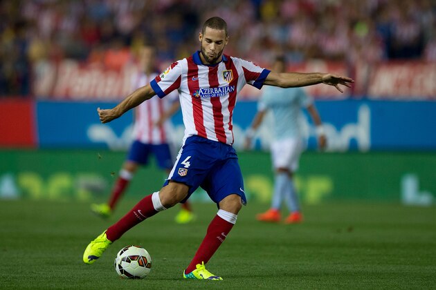 MADRID, SPAIN - AUGUST 30:  Mario Suarez of Atletico de Madrid strikes the ball during the La Liga match between Club Atletico de Madrid and SD Eibar at Vicente Calderon Stadium on August 30, 2014 in Madrid, Spain.  (Photo by Gonzalo Arroyo Moreno/Getty Images)
