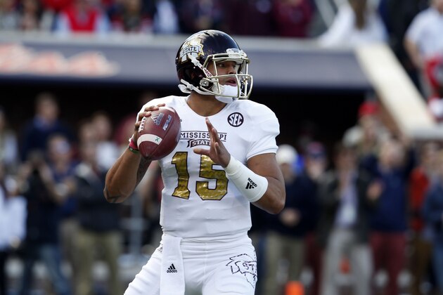 Mississippi State quarterback Dak Prescott (15) prepares to pass against Mississippi during the first half of an NCAA college football game in Oxford, Miss., Saturday, Nov. 29, 2014. No. 18 Mississippi defeated No. 4 Mississippi State, 31-17. (AP Photo/Rogelio V. Solis)