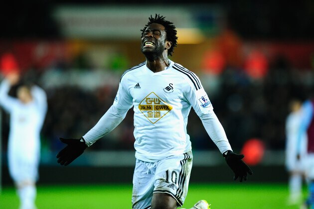SWANSEA, WALES - DECEMBER 26:  Wilfried Bony of Swansea reacts after having a goal dissalowed during the Barclays Premier League match between Swansea City and Aston Villa at Liberty Stadium on December 26, 2014 in Swansea, Wales.  (Photo by Stu Forster/Getty Images)