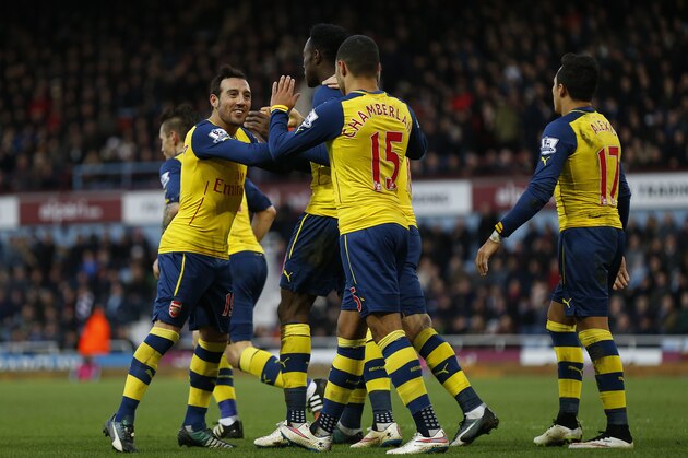 LONDON, ENGLAND - DECEMBER 28:  Danny Welbeck of Arsenal celebrates with team-mates after scoring their second goal from the penalty spot during the Barclays Premier League match between West Ham United and Arsenal at Boleyn Ground on December 28, 2014 in London, England.  (Photo by Steve Bardens/Getty Images)