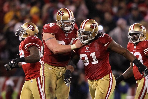 SAN FRANCISCO, CA - JANUARY 22:  Justin Smith #94 and Ray McDonald #91 of the San Francisco 49ers celebrate a defensive play in the second half against the New York Giants during the NFC Championship Game at Candlestick Park on January 22, 2012 in San Francisco, California.  (Photo by Jamie Squire/Getty Images)