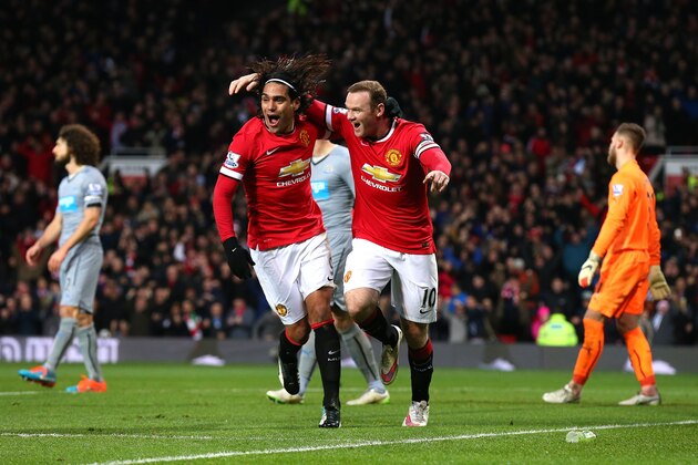 MANCHESTER, ENGLAND - DECEMBER 26:  Wayne Rooney of Manchester United celebrates scoring the first goal with team-mate Radamel Falcao (L) during the Barclays Premier League match between Manchester United and Newcastle United at Old Trafford on December 26, 2014 in Manchester, England.  (Photo by Alex Livesey/Getty Images)