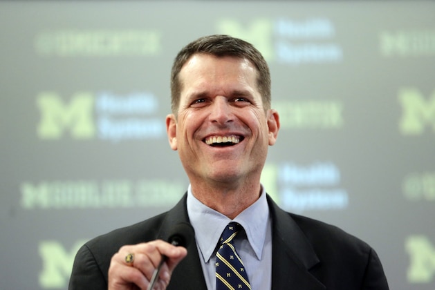 Jim Harbaugh, Michigan's new head football coach, addresses the media after after he was introduced during an NCAA college football news conference Tuesday, Dec. 30, 2014, in Ann Arbor, Mich. (AP Photo/Carlos Osorio)