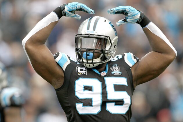 Carolina Panthers' Charles Johnson (95) gets the home crowd fired up during the first half of an NFL football game against the Cleveland Browns in Charlotte, N.C., Sunday, Dec. 21, 2014. The Panthers won 17-13. (AP Photo/Bob Leverone)