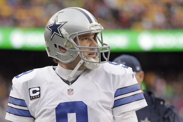 Dallas Cowboys quarterback Tony Romo (9) walks off the field after the first half of an NFL football game against the Washington Redskins in Landover, Md., Sunday, Dec. 28, 2014. (AP Photo/Mark Tenally)