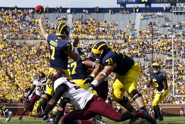 Sep 27, 2014; Ann Arbor, MI, USA; Michigan Wolverines quarterback Shane Morris (7) passes the ball in the first half against the Minnesota Golden Gophers at Michigan Stadium. Mandatory Credit: Rick Osentoski-USA TODAY Sports