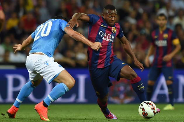GENEVA, SWITZERLAND - AUGUST 06:  Adama Traore (R) of FC Barcelona is challenged by Blerim Dzemaili of SSC Napoli during the pre-season friendly match between FC Barcelona and SSC Napoli on August 6, 2014 in Geneva, Switzerland.  (Photo by Valerio Pennicino/Getty Images)