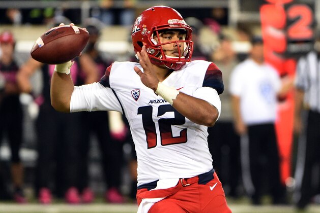 Arizona Wildcats quarterback Anu Solomon (12) passes the ball during the fourth quarter of the NCAA college  football game against Oregon at Autzen Stadium on Thursday, Oct. 2, 2014, in Eugene, Ore. Arizona won the game 31-24. (AP Photo/Steve Dykes)