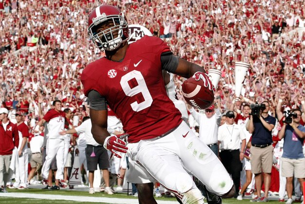 Oct 18, 2014; Tuscaloosa, AL, USA; Alabama Crimson Tide wide receiver Amari Cooper (9) catches a pass for a touchdown against the Texas A&M Aggies at Bryant-Denny Stadium. Mandatory Credit: Marvin Gentry-USA TODAY Sports