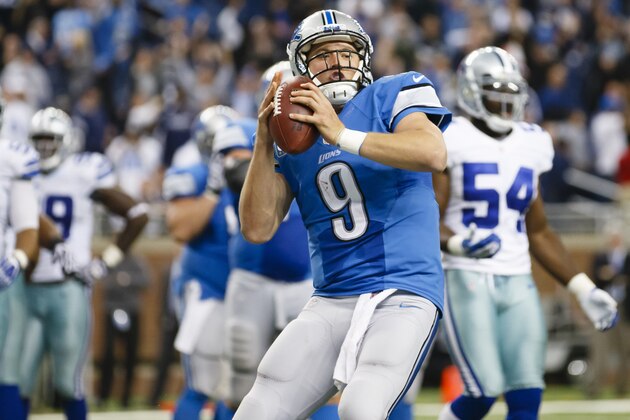 Detroit Lions quarterback Matthew Stafford (9) gets set to spike the ball after scoring a touchdown against the Dallas Cowboys in the fourth quarter of an NFL football game in Detroit, Sunday, Oct. 27, 2013. (AP Photo/Rick Osentoski)