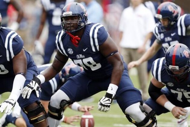 FILE - In this Sept. 13, 2014, file photo, Mississippi offensive linesman Laremy Tunsil (78) steps into his blocking stance during pre-game warmups prior to an NCAA college football game against Louisiana-Lafayette at Vaught-Hemingway Stadium in Oxford, Miss. The Rebels have rocketed from an SEC afterthought to the No. 3 team in the country by bringing in better talent, starting with a talented sophomore class that includes Robert Nkemdiche, Laquon Treadwell and Tunsil. (AP Photo/Rogelio V. Solis)