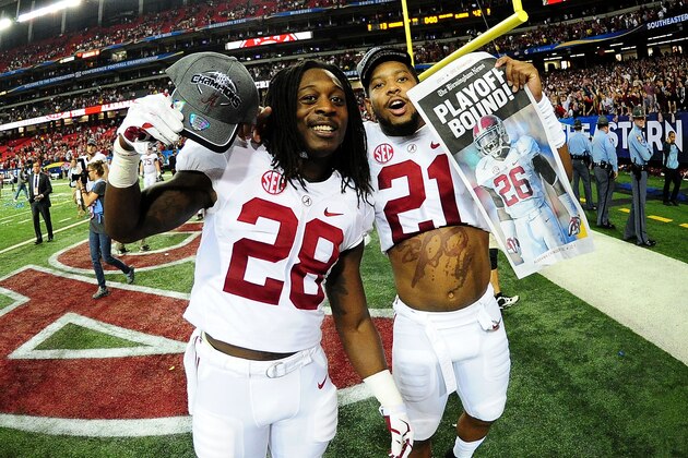 ATLANTA, GA - DECEMBER 06:  Altee Tenpenny #28 and Maurice Smith #21 of the Alabama Crimson Tide celebrate their 42 to 13 win over the Missouri Tigers in the SEC Championship game at the Georgia Dome on December 6, 2014 in Atlanta, Georgia.  (Photo by Scott Cunningham/Getty Images)