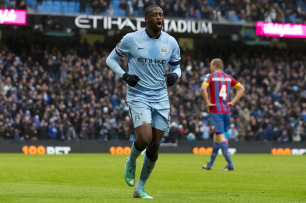Manchester City's Yaya Toure celebrates after scoring against Crystal Palace during the English Premier League soccer match between Manchester City and Crystal Palace at the Etihad Stadium, Manchester, England, Saturday Dec. 20, 2014. (AP Photo/Jon Super)