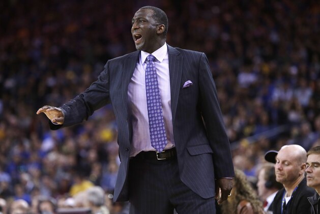 Sacramento Kings head coach Tyrone Corbin yells out instructions during the first half of an NBA basketball game against the Golden State Warriors Monday, Dec. 22, 2014, in Oakland, Calif. (AP Photo/Marcio Jose Sanchez)