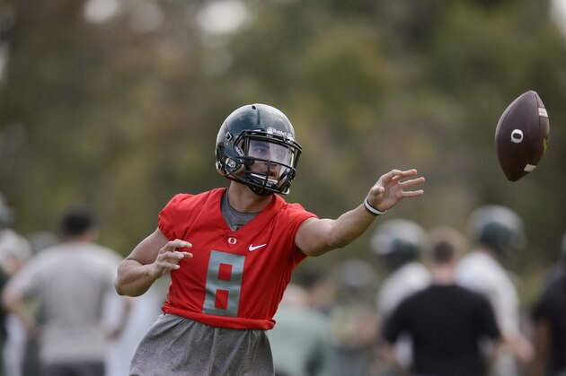 Oregon quarterback Marcus Mariota runs through drills during practice in Carson, Calif., Tuesday, Dec. 30, 2014. Oregon is scheduled to play Florida State in the Rose Bowl NCAA college football playoff semifinal on New Year's Day. (AP Photo/Kelvin Kuo)
