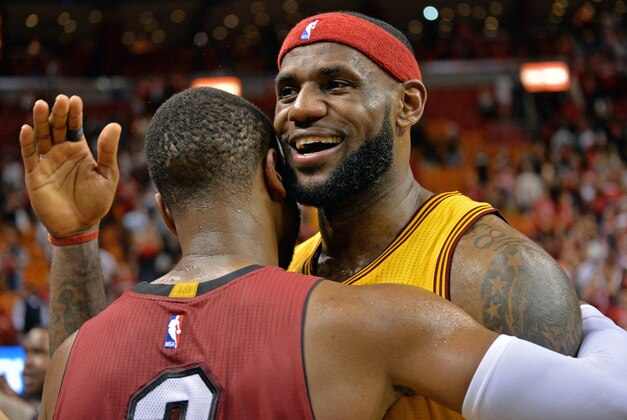 Dec 25, 2014; Miami, FL, USA; Cleveland Cavaliers forward LeBron James (23) hugs Miami Heat guard Dwyane Wade (3) after their game at American Airlines Arena. The Heat won 101-91. Mandatory Credit: Steve Mitchell-USA TODAY Sports