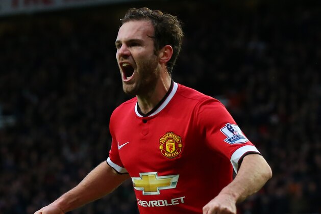 MANCHESTER, ENGLAND - DECEMBER 14:  Juan Mata of Manchester United celebrates scoring the second goal during the Barclays Premier League match between Manchester United and Liverpool at Old Trafford on December 14, 2014 in Manchester, England.  (Photo by Alex Livesey/Getty Images)